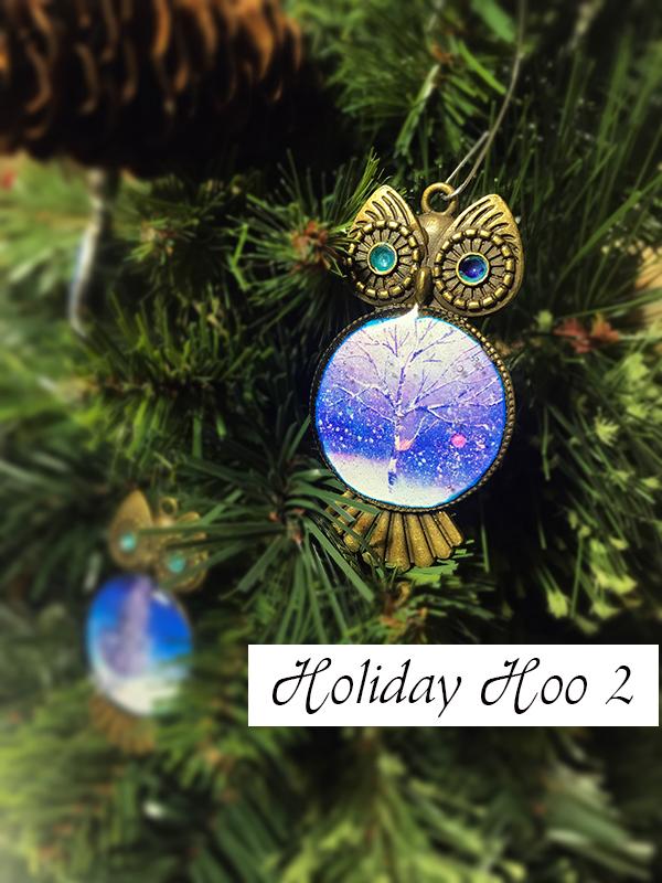 Bronze owl Christmas tree ornaments with blue jewel eyes and painted christmas card stomach prints.