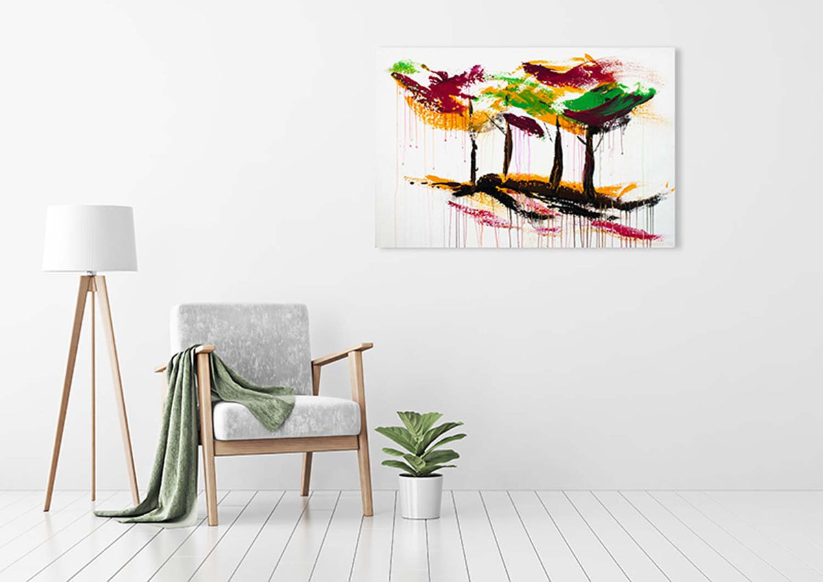 Original abstract wall art of colorful forest with magenta, green, yellow, and black trees as sen décor in an urban loft