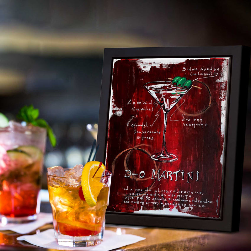 Classy home bar with drinks and framed painting of 3 Olive Martini on red abstract background with sketched recipe