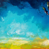 Tropical décor painting of a colorful sunset of navy, blue, orange, and gold over the ocean