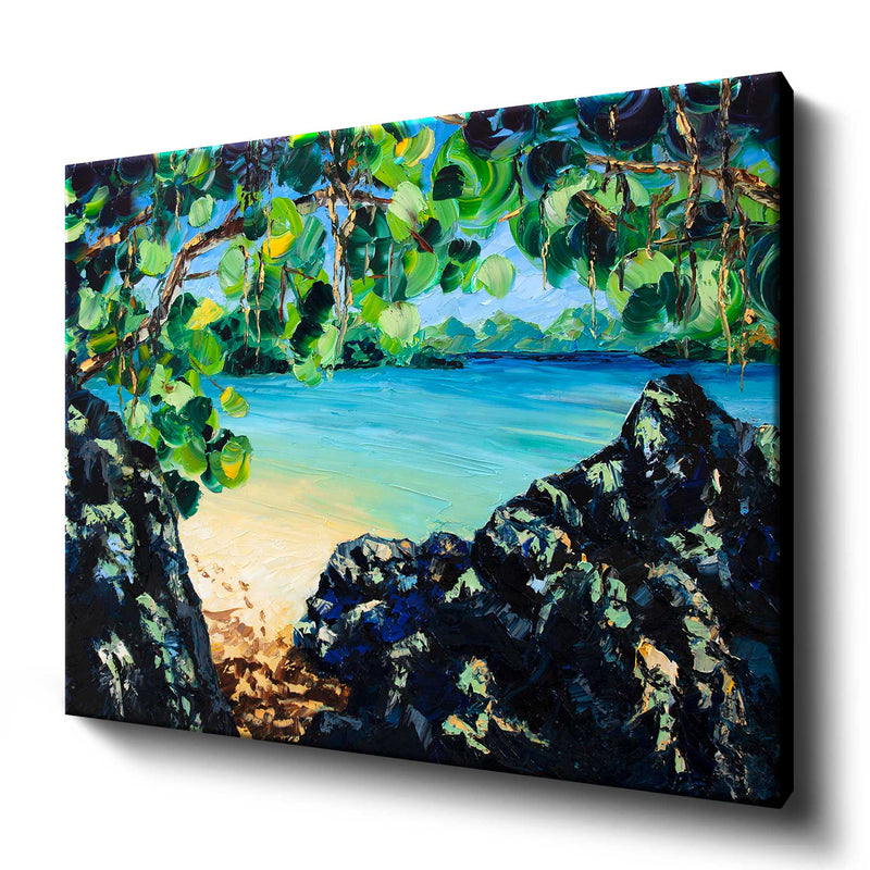 Printed art canvas of lush tropical beach on a blue lagoon with sandy footprints in the sun
