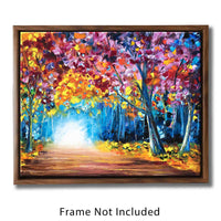 Framed nature wall art canvas showing a fall landscape painting of an autumn forest with a path through the trees.