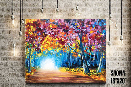 Large wall art on canvas of a colorful fall forest with a glowing path leading through the trees.