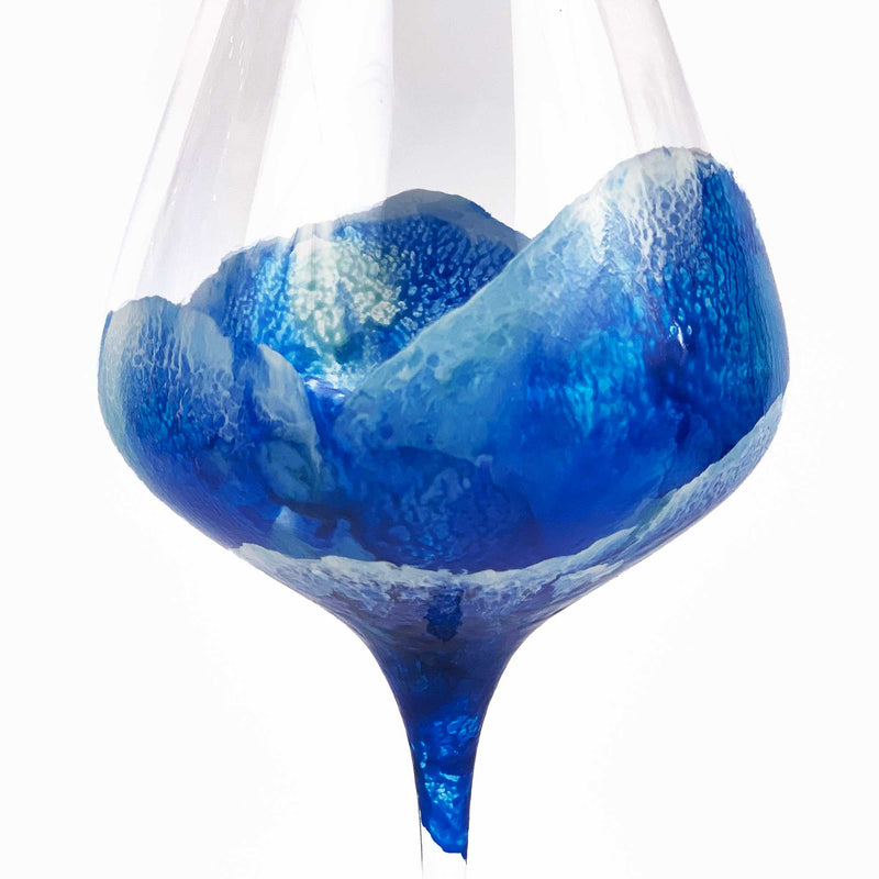 Custom glass for beach themed wedding gift, with blue ocean waves wrapping a red wine glass.
