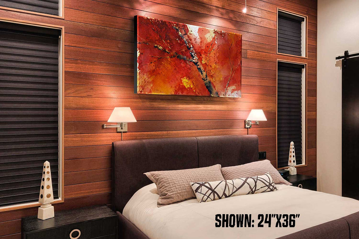 Red and orange watercolor print of large fall foliage art. Shown as fall decor for bedroom in a mountain cabin.