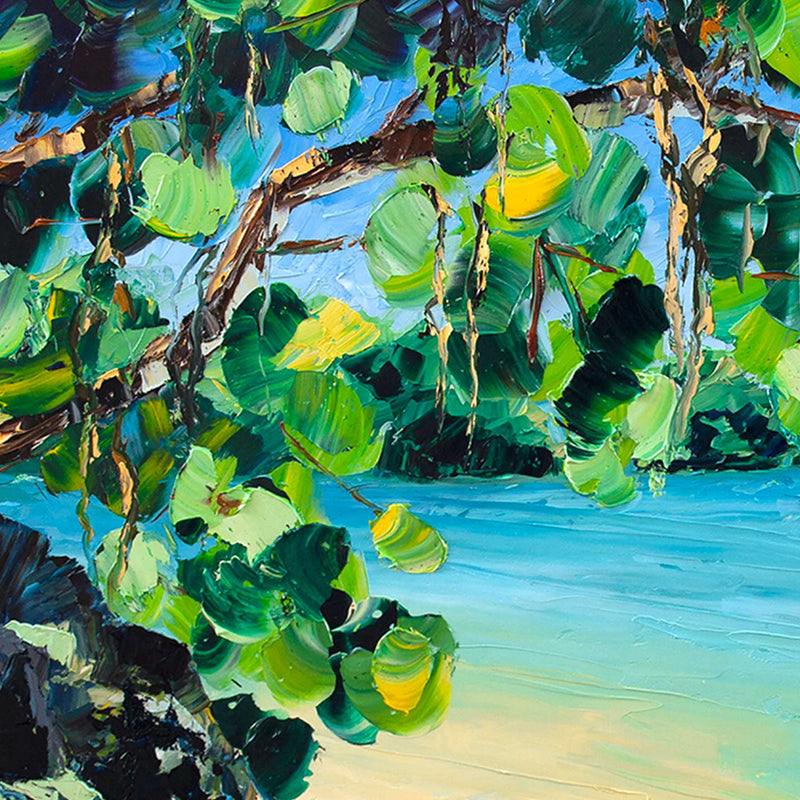 Kauai wall art of a secluded beach and lava rocks beside the bright blue Pacific Ocean