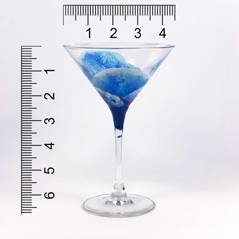 Blue and white nautical martini glass with abstract blue ocean surf, shown with a ruler for scale.