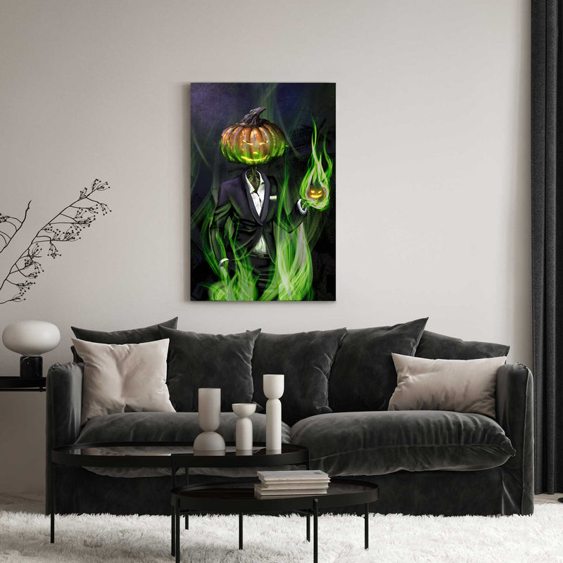 A 24" by 36" canvas print of a Pumpkinhead Man wearing a tuxedo and holiding a mini-jack o'lantern in his hand. Both pumpkins glow from the inside with a strange orange light. Green, magical fire swirls around them.  The print hangs in a stylish living room.
