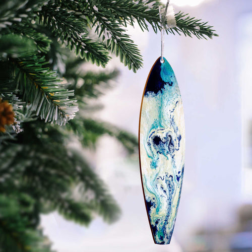 Beach Christmas tree ornaments with blue and white ocean swirls painted on a hand-made wood surfboard ornament.