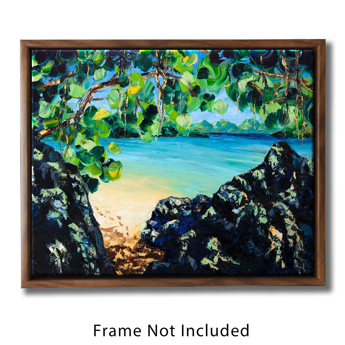 Beach house décor of a hidden tropical cove with clear turquoise water and green overhanging foliage on a white sand beach