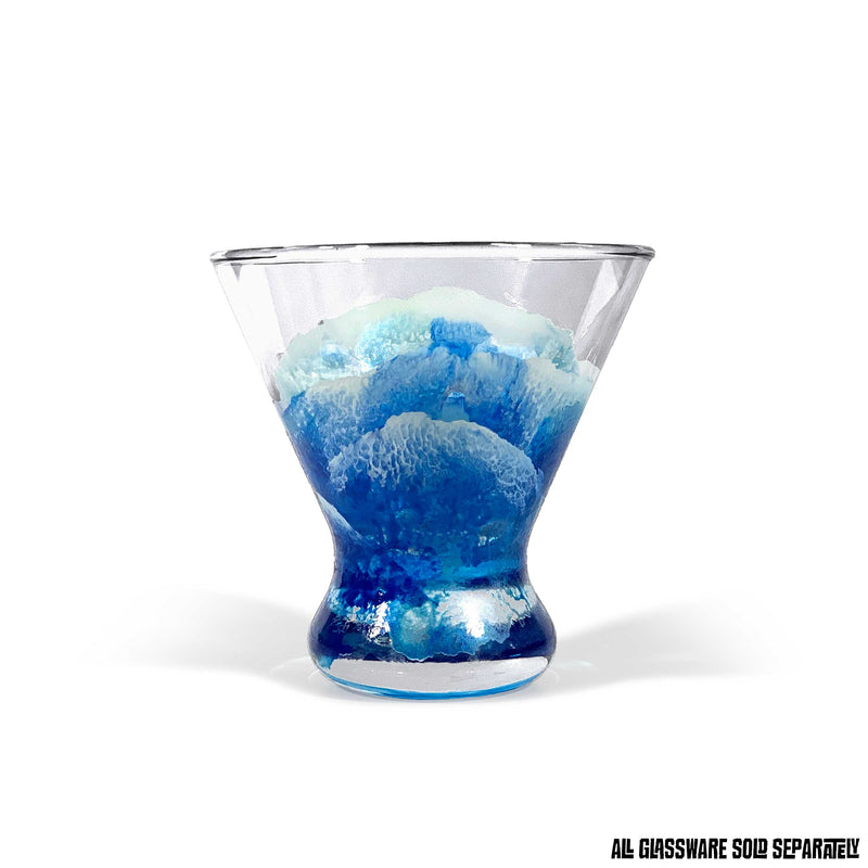 Contemporary martini glass with abstract ocean waves wrapping around the glass. Hand-painted blue and white translucent texture.