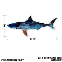 A wooden shark wall art piece with measured dimensions of 38.5" x 16"