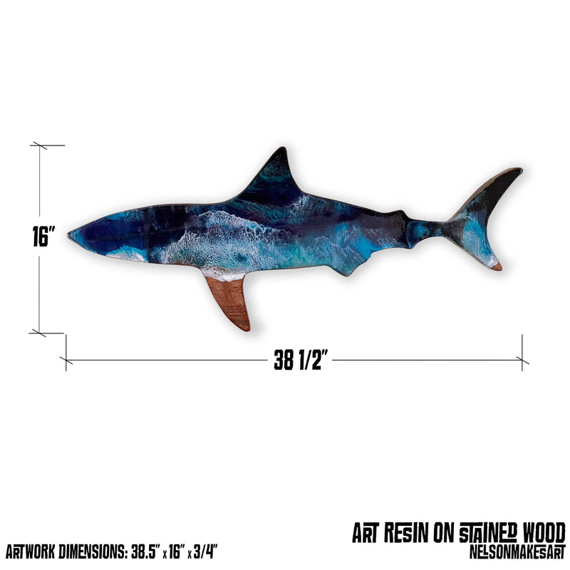 A wooden shark wall art piece with measured dimensions of 38.5" x 16"