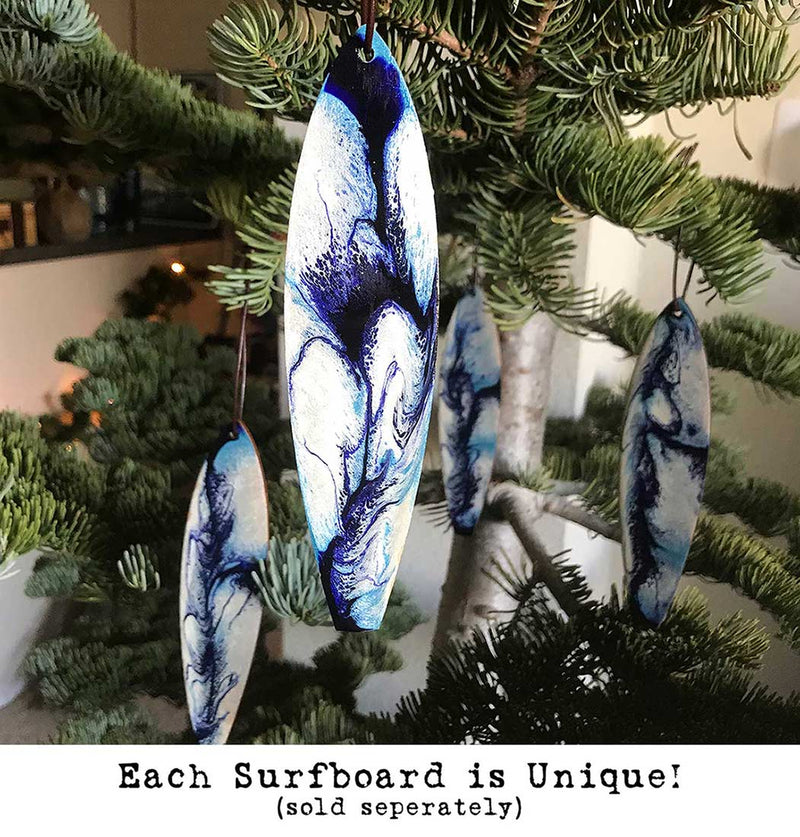 Coastal Christmas tree decorations with blue and white painted ocean swirls for surfing Christmas present idea.