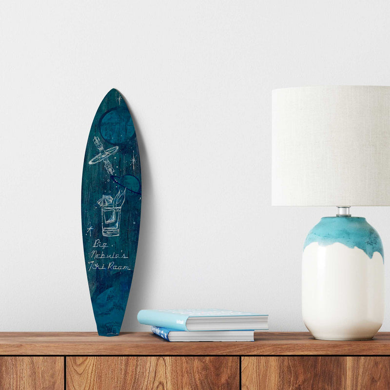 Space-themed tiki-style mini-surfboard prominently displayed on a table in a living room