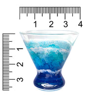 Custom hand-painted martini glass with blue and white ocean waves. Shown with size scale in inches.