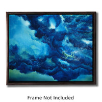 Framed ocean wall art of a surfer diving beneath a rolling blue wave